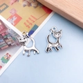 Cute antique silver cat charms for DIY jewelry making with hollow paw print details - Dynamic Cat Pendant (10870)