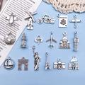 Set de 16 dijes de viaje vintage en plata con Torre Eiffel, avión y monumentos mundiales - Accesorios de Viaje Mixto 17 (SN122)