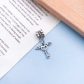 Vintage silver heart key charm with angel wings for DIY jewelry on light blue background - Antique Silver Winged Key (11474)