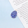 Easter egg charm in dark blue enamel with colorful dots and golden metal trim - Red Polka Dot Egg