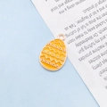 Orange Easter egg alloy pendant with geometric enamel patterns for DIY jewelry making - Solid Yellow Egg
