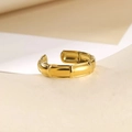 Close-up of golden bamboo-joint style adjustable ring on minimalist geometric stand - Bamboo Shape Style (40384) / Gold