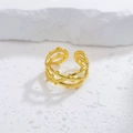 Detail of a golden multi-layer braided ring with delicate bead texture on stone surface - Beaded Multi-Layer Style (40348-1)