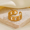 Detail of gold open ring with cutout daisy pattern and beaded edge on stone - Hollow Daisy Style (40299-1)