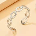 Detailed view of silver chain link open bangle in polished stainless steel finish - O-Shaped Chain / Silver