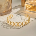 Detail shot of hollow heart pattern adjustable gold plated stainless steel bracelet - Hollow Heart / Gold