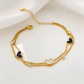 Double-layered gold titanium steel bracelet with black hearts and white shell charms - 18K Gold / White Heart