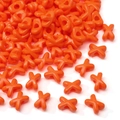Vibrant orange X-shaped acrylic beads with glossy finish and center hole for DIY jewelry - Orange