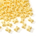 Creamy light yellow acrylic X and O spacer beads with glossy finish for DIY jewelry - Pale Yellow