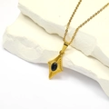 Detailed close-up of a vintage gold diamond pendant necklace on a white stone base - Gold Black