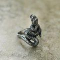 Detailed view of snake ring scale textures and vintage silver finish on stone surface - Steel Color Climbing Wrap Style 9