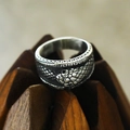 Macro detail of retro snake ring with intricate scales on textured wooden stand - US 7 / Steel Color Vintage Wrap Style 2