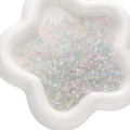 Mix of colorful translucent chameleon glass beads in a star ceramic tray for DIY jewelry - 450g Pack (2x4mm, Approx. 6700 Pieces) / Macarons