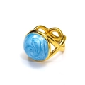 Detail view of 18k gold plated ring with blue enamel swirl pattern and woven band - Gold Blue Enamel