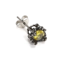 Macro shot of vintage Gothic style earring with yellow round zircon and dark aged metal - Steel Yellow Zirconia