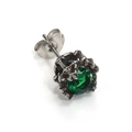 Macro shot of a dark green zircon stud earring with vintage textured metal claw - Silver With Green Zircon