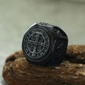 Macro shot of vintage Saint Benedict cross ring with oxidized silver finish detail - US 7 / Black