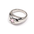 Detailed macro of silver domed ring featuring a pink star-shaped zirconia inlay - Stainless Steel Silver Color Pink Zirconia