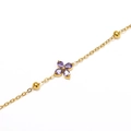Detailed macro view of gold clover bracelet with purple marquise zircon stones - Gold Purple Zirconia