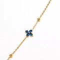 Detailed macro view of gold-plated clover bracelet with blue drop-shaped rhinestones - Gold Plated Blue Zirconia