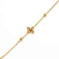 Detailed macro view of gold-plated clover bracelet with sparkling champagne gemstone inlay - Gold Champagne Stone
