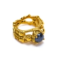 Macro detail of gothic gold skeleton ring with dark grey gemstone inlay in punk style - US 6 / Gold Black Ceramic