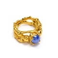 Detail of gothic skull ring with gold skeletal band and blue dome gemstone inlay - Gold Blue