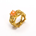 Gothic punk gold skull ring featuring a vibrant orange bead and intricate engravings - Gold Orange