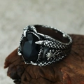 Detailed view of gothic dragon claw ring featuring a large oval black gemstone setting - US 7 / Steel Color Black Gemstone