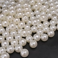 Creamy white ABS imitation pearls with holes for DIY jewelry making on black background - Round Bead Style (23)