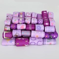 Collection of purple grosgrain ribbons with diverse patterns like polka dots and florals - Purple Tone Series