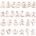 Macro shot of 26 gold-plated alloy alphabet pendants with white enamel for DIY jewelry - A-Z Full Set / 26Pcs/Set / White