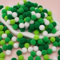 Green and white Christmas polyester pom poms for DIY crafts in a white ceramic dish - 100pcs Pack / 1.5cm / Green System