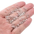 Silver hollow triangle spacers for DIY jewelry making held in palm for size scale - Triangle Beads 4x4mm (Aperture 1.5mm) / Silver (Approx. 25 Pieces/Pack)