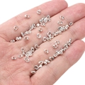 Irregular silver alloy spacer beads for DIY jewelry displayed on hand for scale - Irregular Spacer 3x4mm (Aperture 1.5mm) / Silver (Approx. 25 Pieces/Pack)