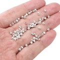 Silver textured wheel round beads for DIY jewelry making displayed on a palm - Carved Round Beads 3x3mm (Aperture 1.5mm) / Silver (Approx. 25 Pieces/Pack)