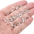 Polished silver alloy rectangular tube beads for DIY jewelry making held in a hand - Rectangular Strip 4x2x2mm (Aperture 1mm) / Silver (Approx. 25 Pieces/Pack)
