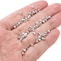 Faceted silver metal loose beads for DIY jewelry making shown in hand for size - Faceted Round Beads 3mm (Aperture 1mm) / Silver (Approx. 25 Pieces/Pack)
