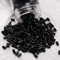 High quality black DIY glass beads for handmade jewelry on a white ceramic plate - Bugle Beads (#15)