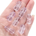 Translucent lavender peanut shaped glass beads for DIY jewelry making on a palm - 12x23mm (Aperture 1mm) / Light Purple