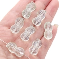 Pale green peanut-shaped glass beads for jewelry making held in a hand - 12x23mm (Aperture 1mm) / Light Green
