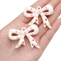 Ciondoli a fiocco in acrilico bianco crema con pois colorati per gioielli fai-da-te - Fiocco (49x41mm)