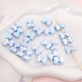 Iridescent light blue bow-shaped acrylic beads with pearl finish for DIY jewelry - 2 Pieces/Pack (15×11mm) / Blue