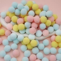 Colorful macaron plush balls in pink, yellow, and blue for DIY creative craft projects - 50 Pieces / 2cm / Light Mixed Theme
