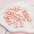 Pink pearlescent acrylic bow beads for DIY bracelets and jewelry making - 2 Pieces/Pack (15×11mm) / Orange