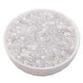 White mixed glass seed beads in a ceramic bowl for DIY jewelry and embroidery - Iridescent White