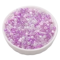 Mixed lavender and purple glass beads in a white bowl for DIY jewelry crafting - Lilac Purple