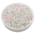 Mixed pastel glass seed beads and bugle beads in a white bowl for DIY jewelry making - Mint Green