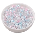 Mixed pastel glass seed and bugle beads for DIY jewelry in a ceramic bowl - Iridescent Pink