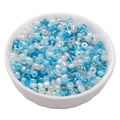 Blue and white mixed glass seed beads in a porcelain bowl for DIY jewelry making - Raven Blue
